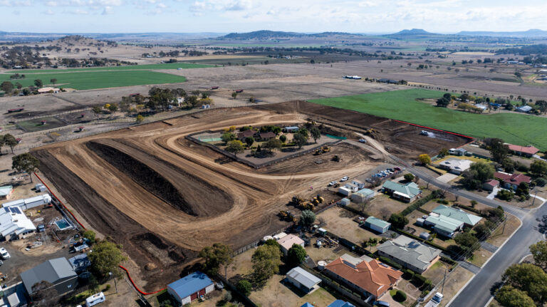 Ongoing civil works at Katrina Court, Westbrook, Toowoomba, showing tree clearing, road construction, and underground services for a 55-lot residential development.