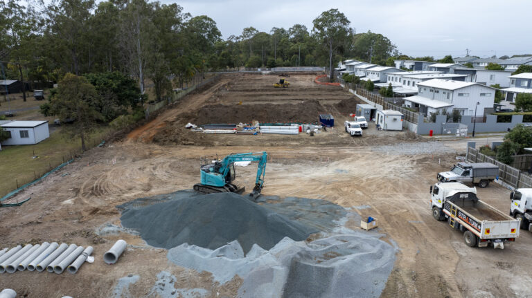 Aerial view of the completed residential subdivision at Beckett Road, Bridgeman Downs, showcasing roadworks, underground services, and site preparation.