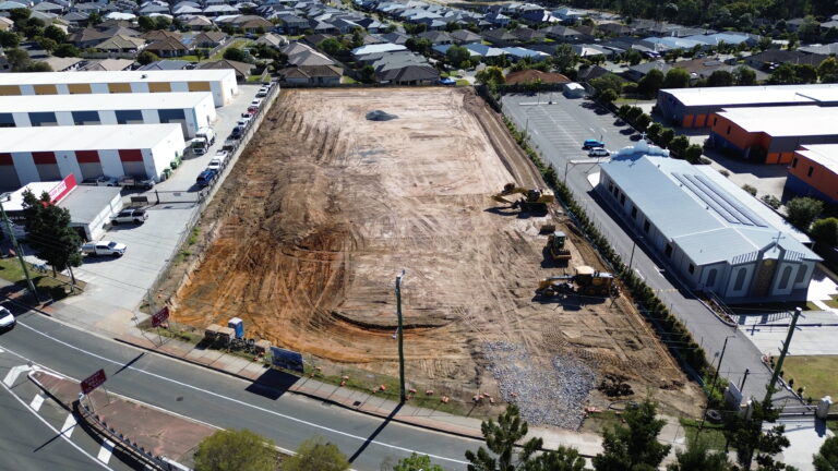 Aerial view of the commercial development site at Middle Road, Hillcrest, featuring bulk earthworks and retaining wall construction.