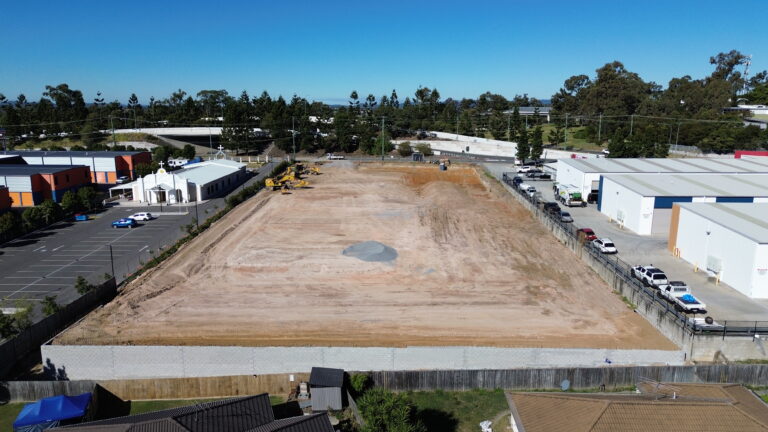Aerial view of the commercial development site at Middle Road, Hillcrest, featuring bulk earthworks and retaining wall construction.