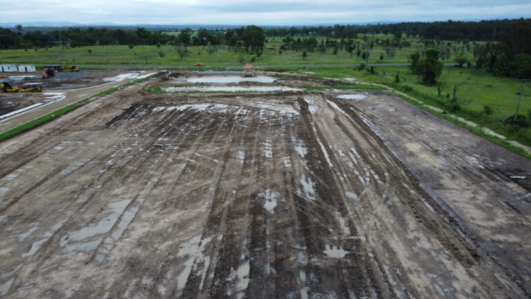 Ongoing civil works at Laidley Plainland Road, Plainland, showcasing road construction, tree clearing, and underground service installation for a rural residential subdivision.