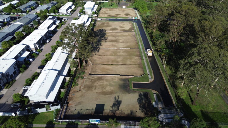 Aerial view of the completed residential subdivision at Beckett Road, Bridgeman Downs, showcasing roadworks, underground services, and site preparation.
