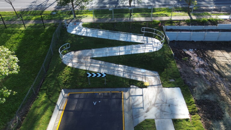 Aerial view of the completed residential subdivision at Beckett Road, Bridgeman Downs, showcasing roadworks, underground services, and site preparation.
